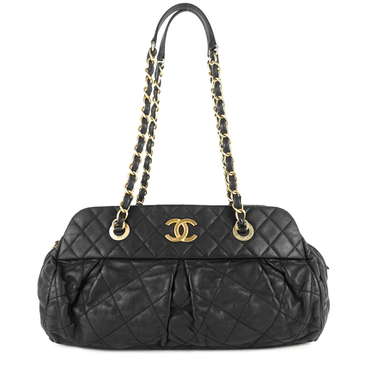 chic quilted iridescent calfskin leather bowling bag