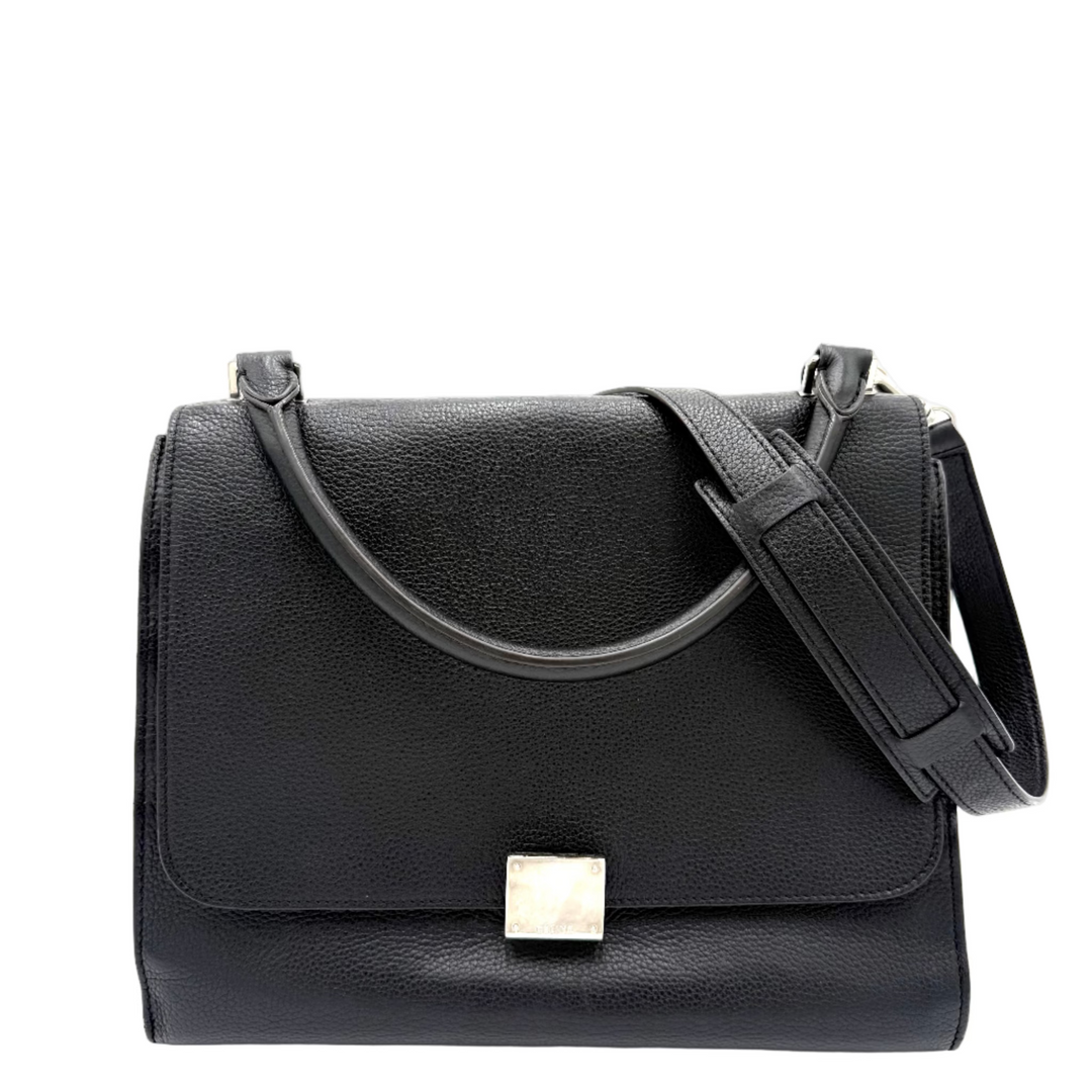Celine Black leather handbag with a silver clasp on a white background 
