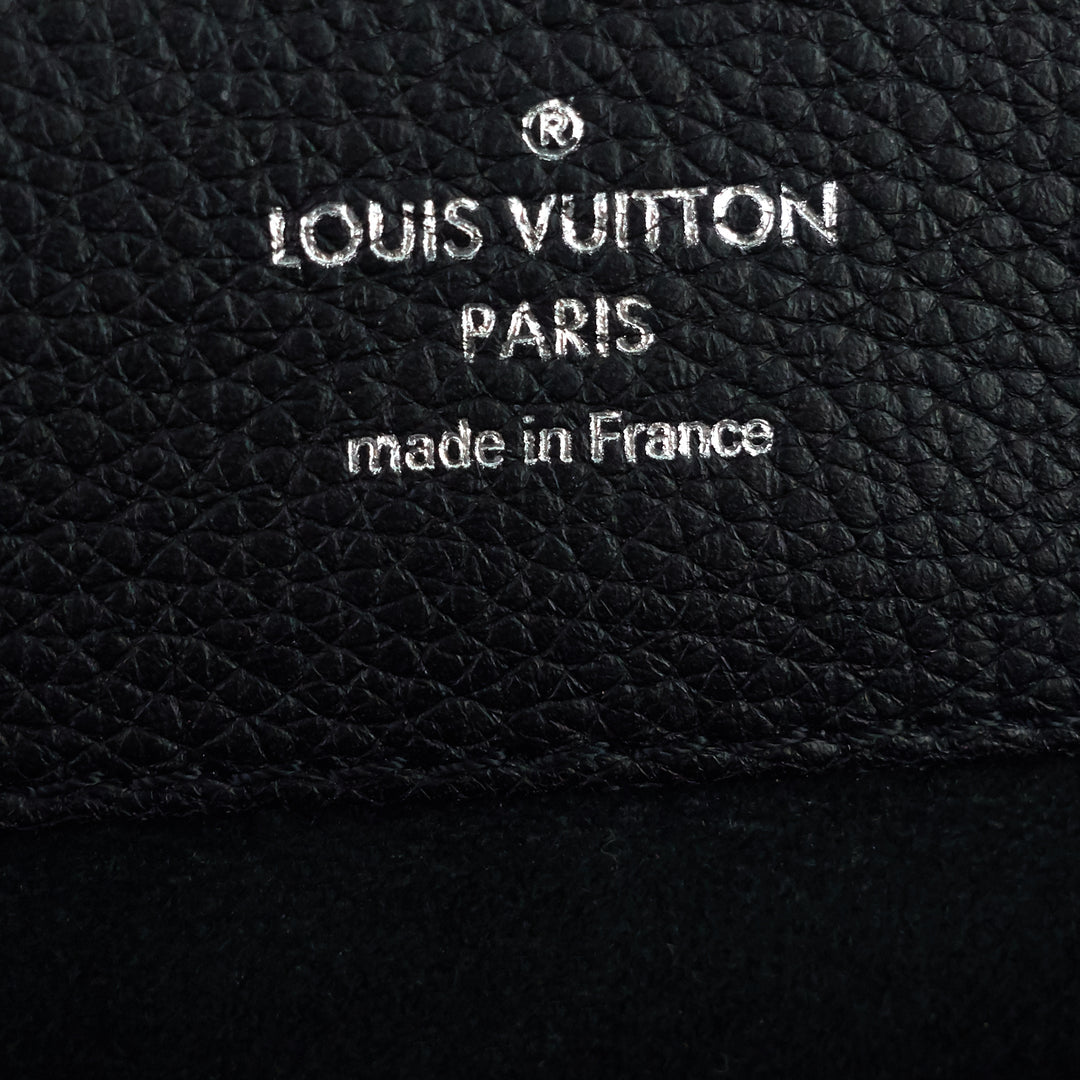 At Auction: Louis Vuitton, Louis Vuitton Lockme Black Leather Mini Backpack