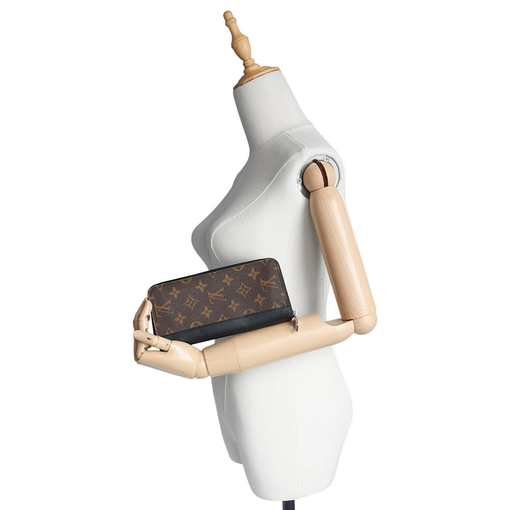 Vertical Zippy Monogram Macassar Canvas Wallet