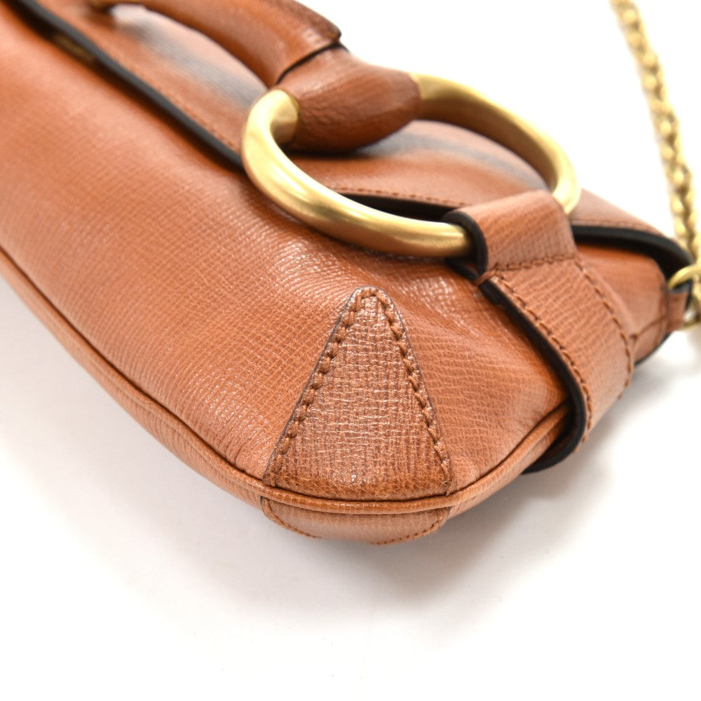 textured leather horsebit evening bag