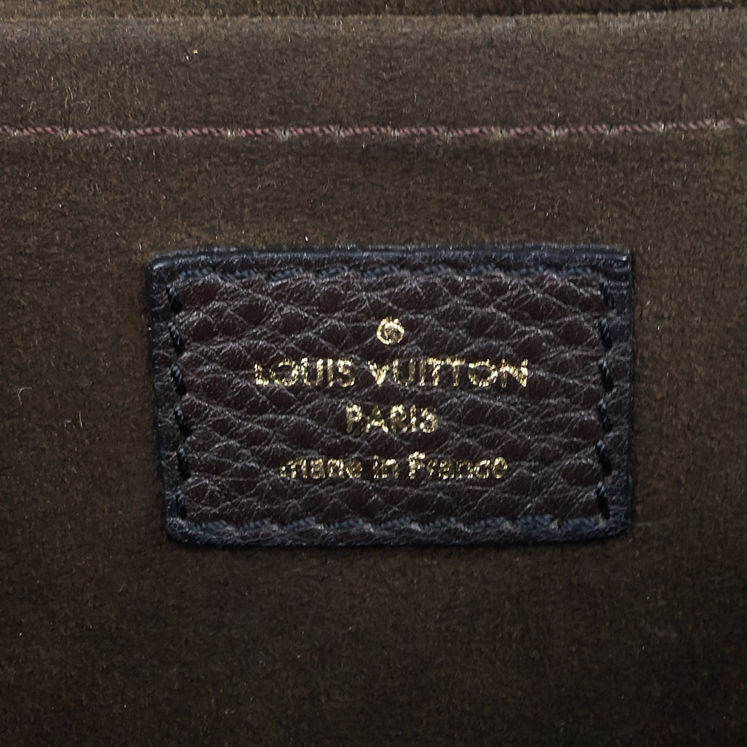 perforated monogram mahina leather xs bag