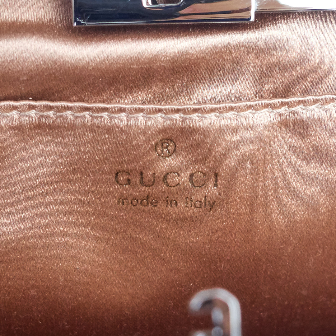 rosette lambskin leather clutch bag