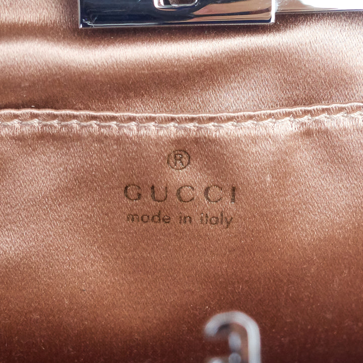 rosette lambskin leather clutch bag