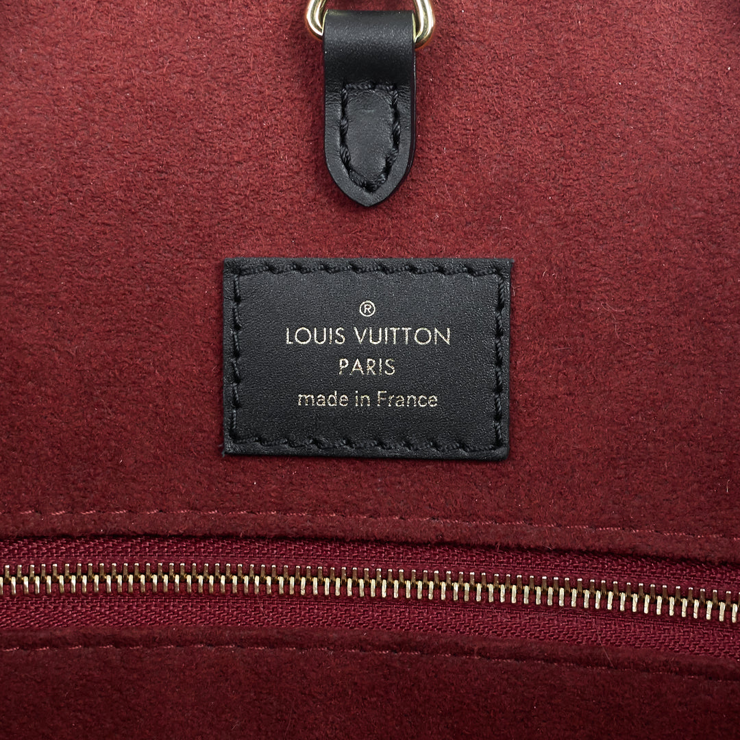 onthego mm bicolour monogram empreinte leather bag