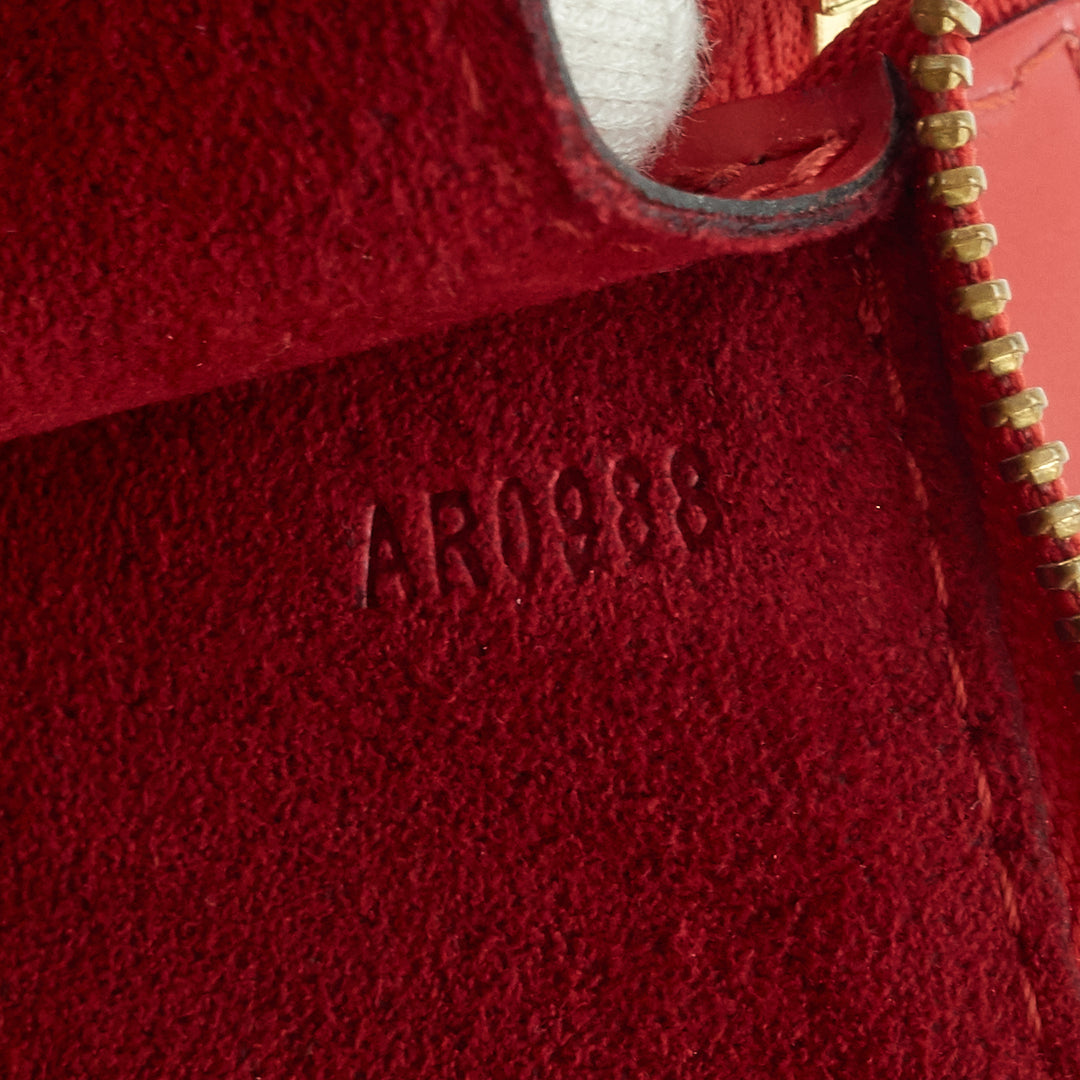 pochette accessoires red epi leather handbag