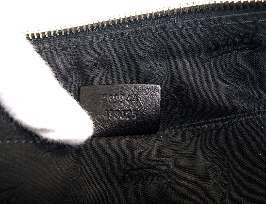 sienna grained leather tassel clutch bag
