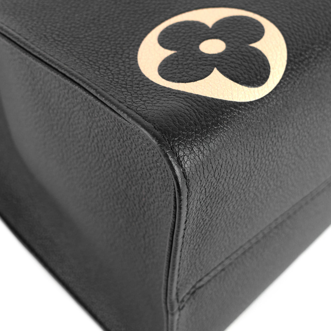 onthego mm bicolour monogram empreinte leather bag