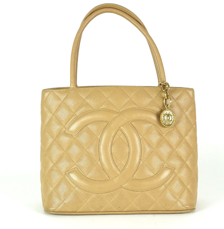 quilted caviar leather suspended medallion tote bag