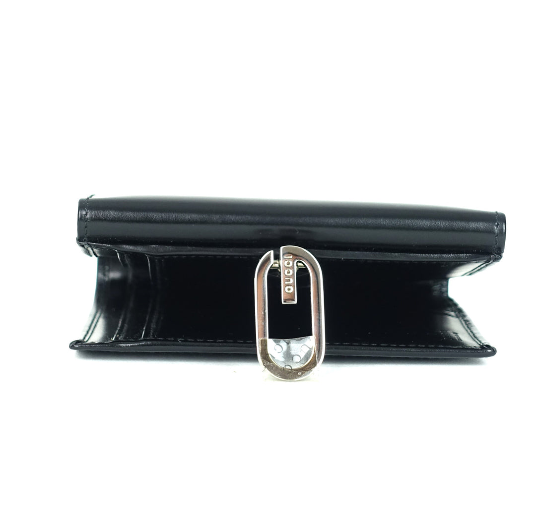 lacquered leather bifold wallet