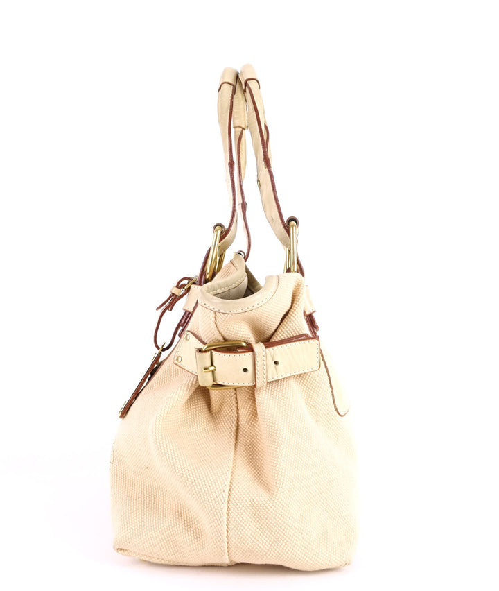 beige canvas and leather tote bag