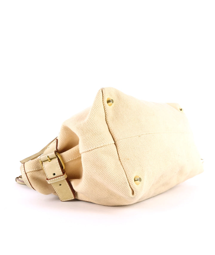 beige canvas and leather tote bag